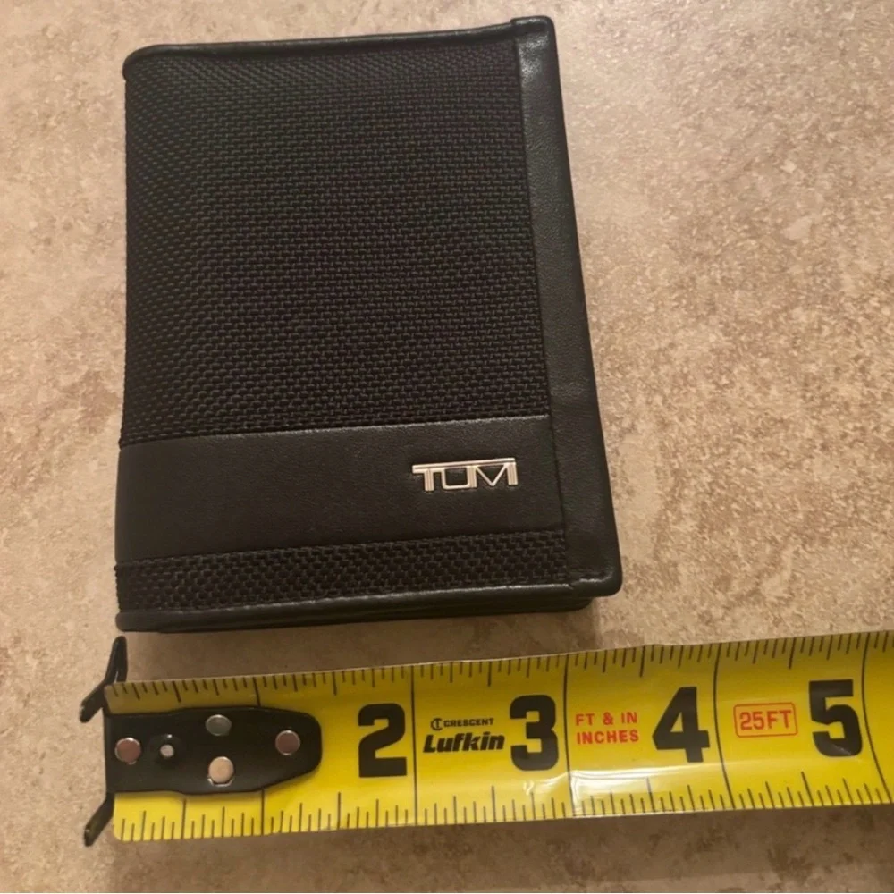 Tumi Black Textured Wallet new without tags in excellent condition